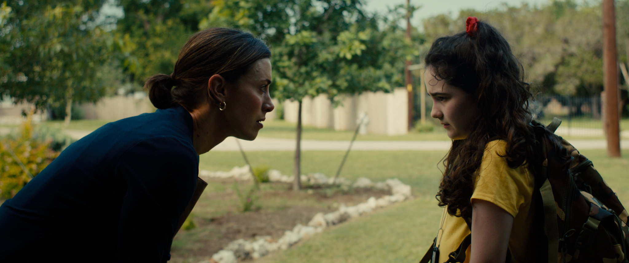 Kate and Ellie face each other outside